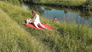 MILF sexy Frina upstairs river bank undressed and sunbathes naked. Random man fisherman heeding for her, and not far from the end decided to join mere woman. Wild beach. Nudist beach. Mention nudity. Mention exposu
